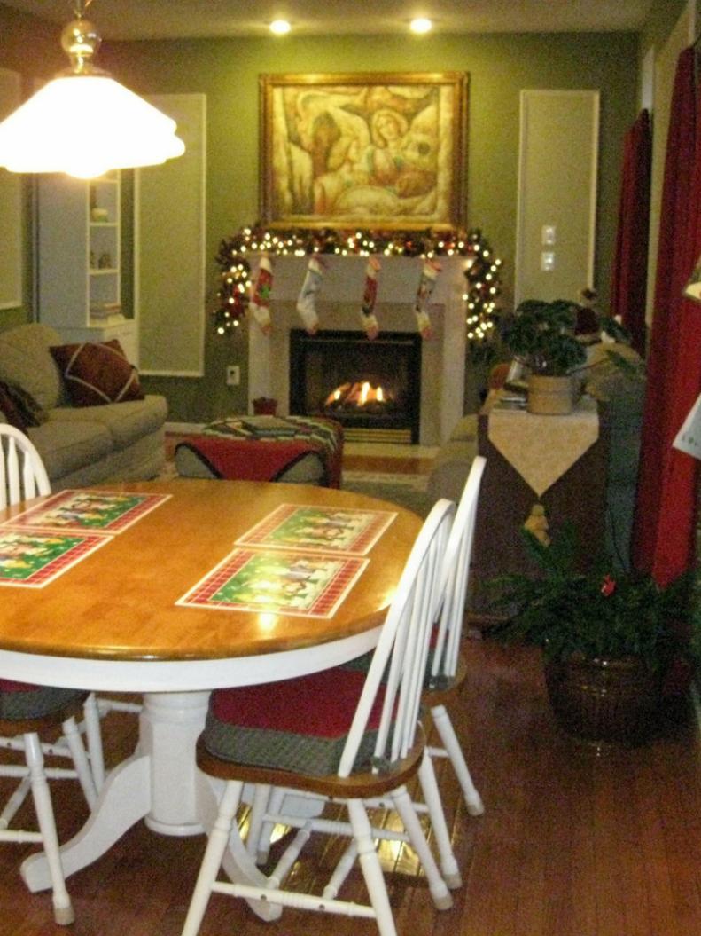 Crowded living room with decorated fireplace