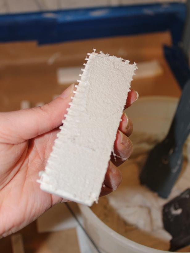 When applying individual tiles in tight spaces, &quot;back-butter&quot; the tiles by spreading a layer of mortar onto the back of each tile rather than applying the mortar directly to the wall. This method is ideal for applying tiles around outlets.