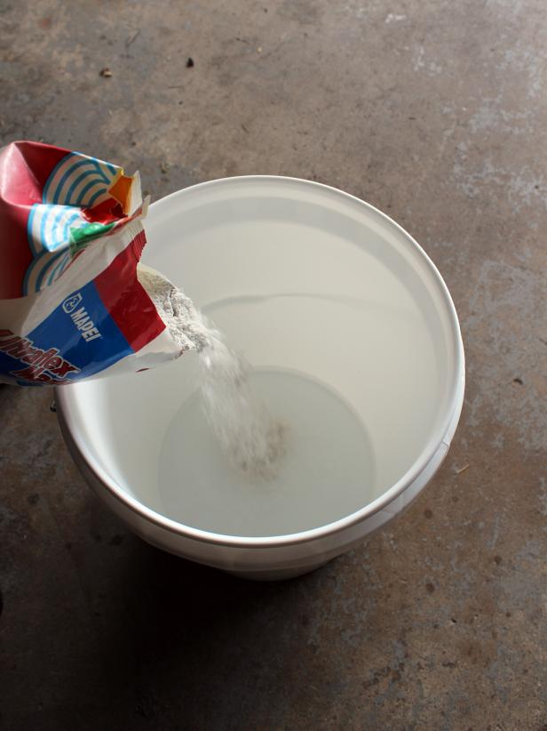 Use a large bucket to mix the mortar with water according the to manufacturer's instructions.