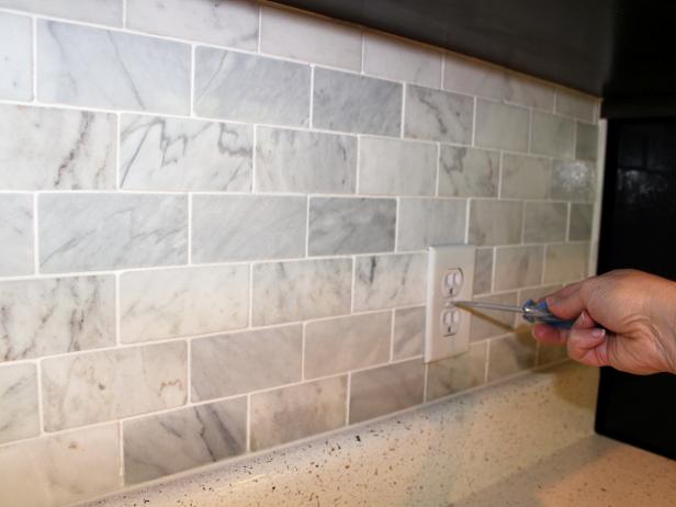 Once your backsplash is installed and the grout is dry, replace the covers on the electrical outlets. Now your kitchen is ready to decorate and enjoy.