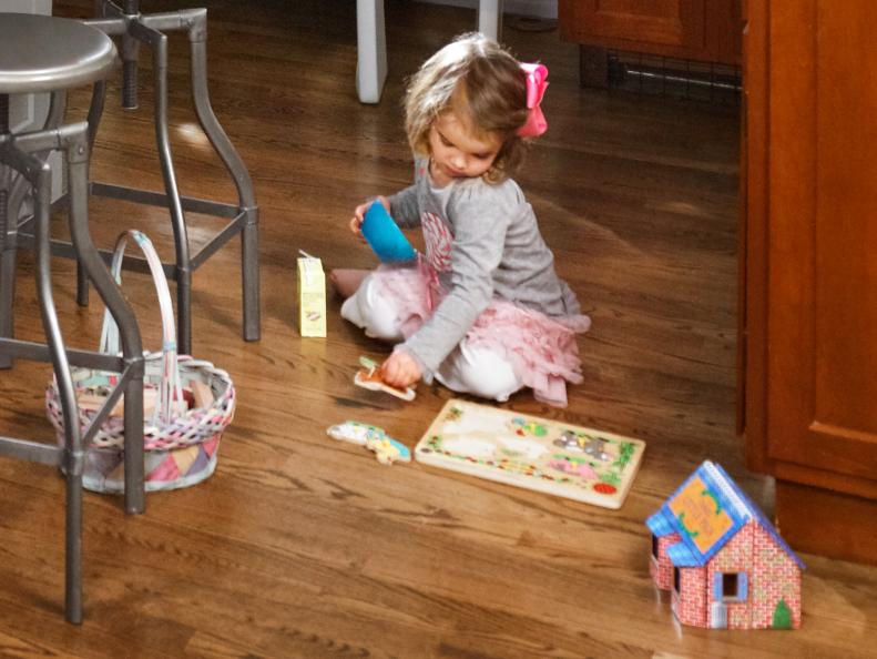 child playing in spacious kitchen 