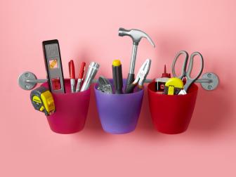 Colorful Hanging Plastic Buckets Containing Tools