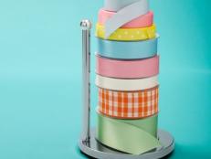 Silver Paper Towel Holder Holding Colorful Ribbons