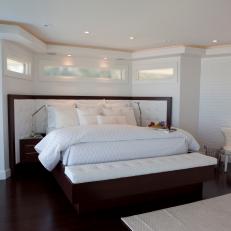 White Modern Bedroom With Dark Wood Floors