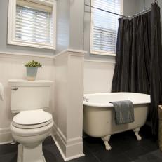 Renovated Bathroom With Beadboard Panels and Blue-Gray Walls