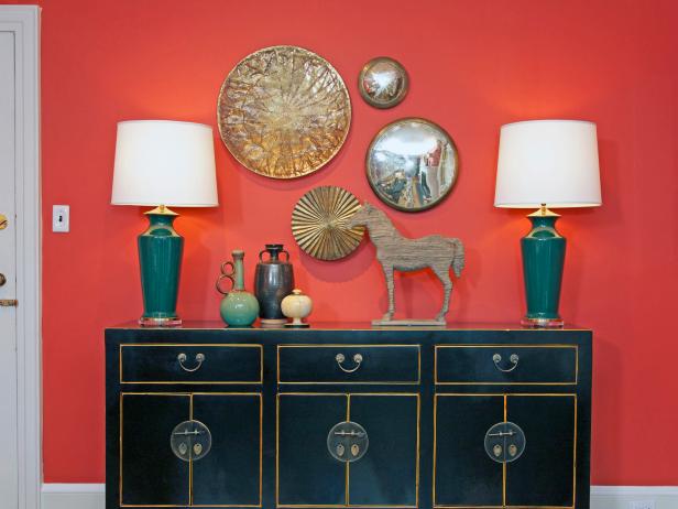 Black Asian Dresser With Red Wall And Gold Wall Decor Hgtv