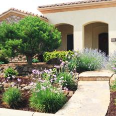 Tuscan-Style Outdoor Entryway With Landscaping
