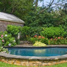 Pool With Stone Surround and Charming Cottage