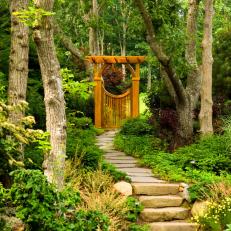 Outdoor Stone Walkway With Asian Gate and Pergola