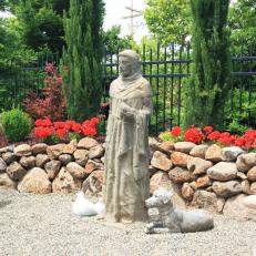 Garden Statue and Flowers in Outdoor Seating Area