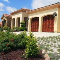 Tuscan-Style Home Exterior With Thyme-Filled Driveway
