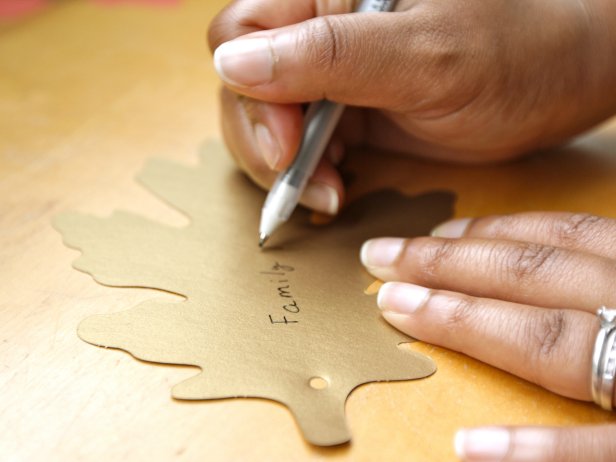 When guests arrive, provide them with a leaf and a black gel pen to write what they are thankful for.