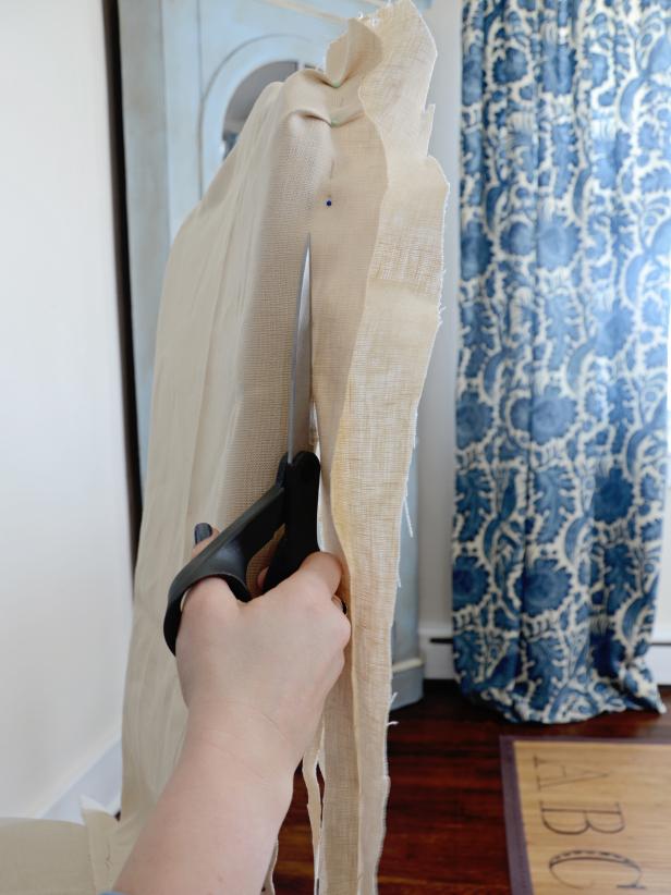 Cut off excess fabric with sharp scissors. Remove from chair and sew along pin line. Remove pins and return slipcover to chair (still inside out).