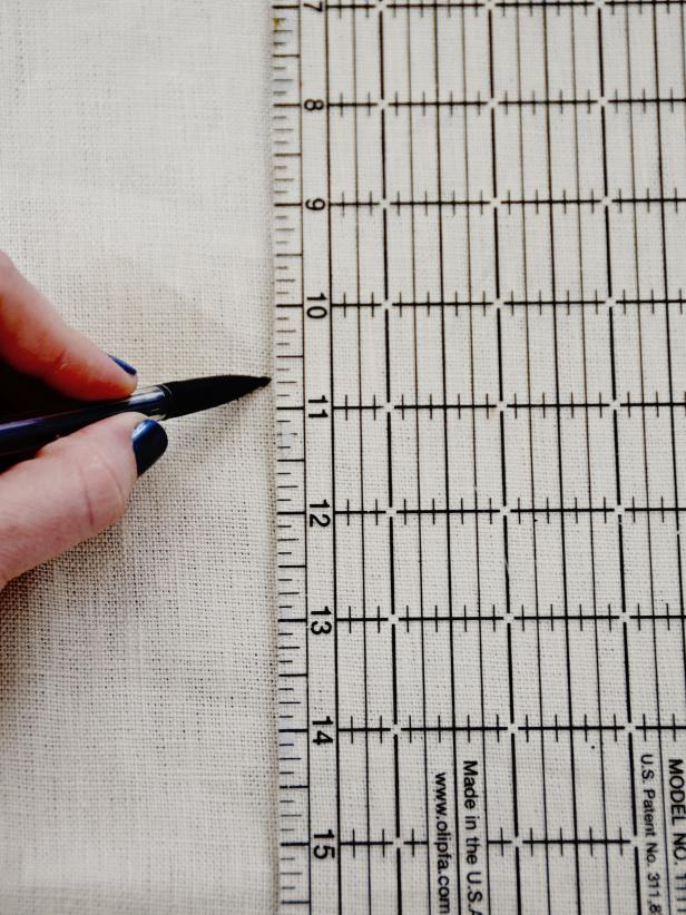 Use a clear quilting ruler to mark off 6-inch-wide strips of fabric. When sewn together, they should be about twice the length of the chair seat perimeter.