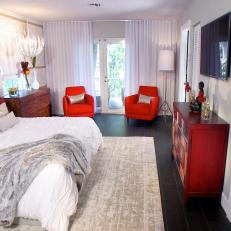 Eclectic White Bedroom With Red Accents