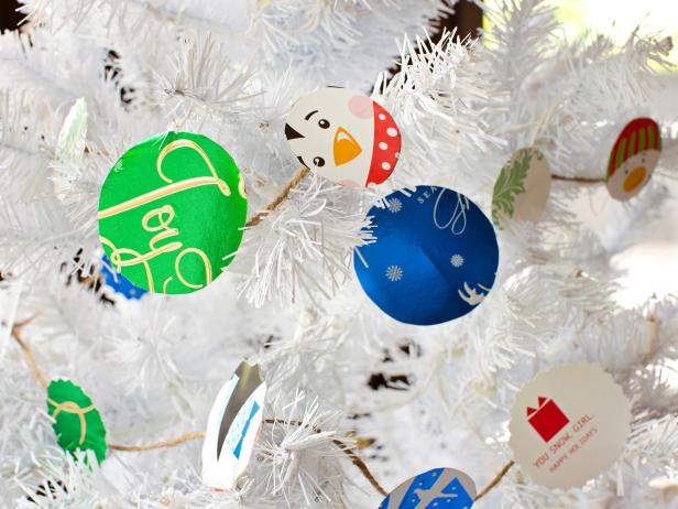 Drape garland around your tree, turning the card circles so the most colorful side is visible.