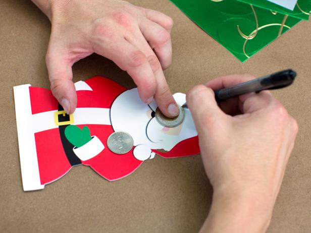 Using a cup, plate or coin as a template, trace various-sized circles onto holiday cards.