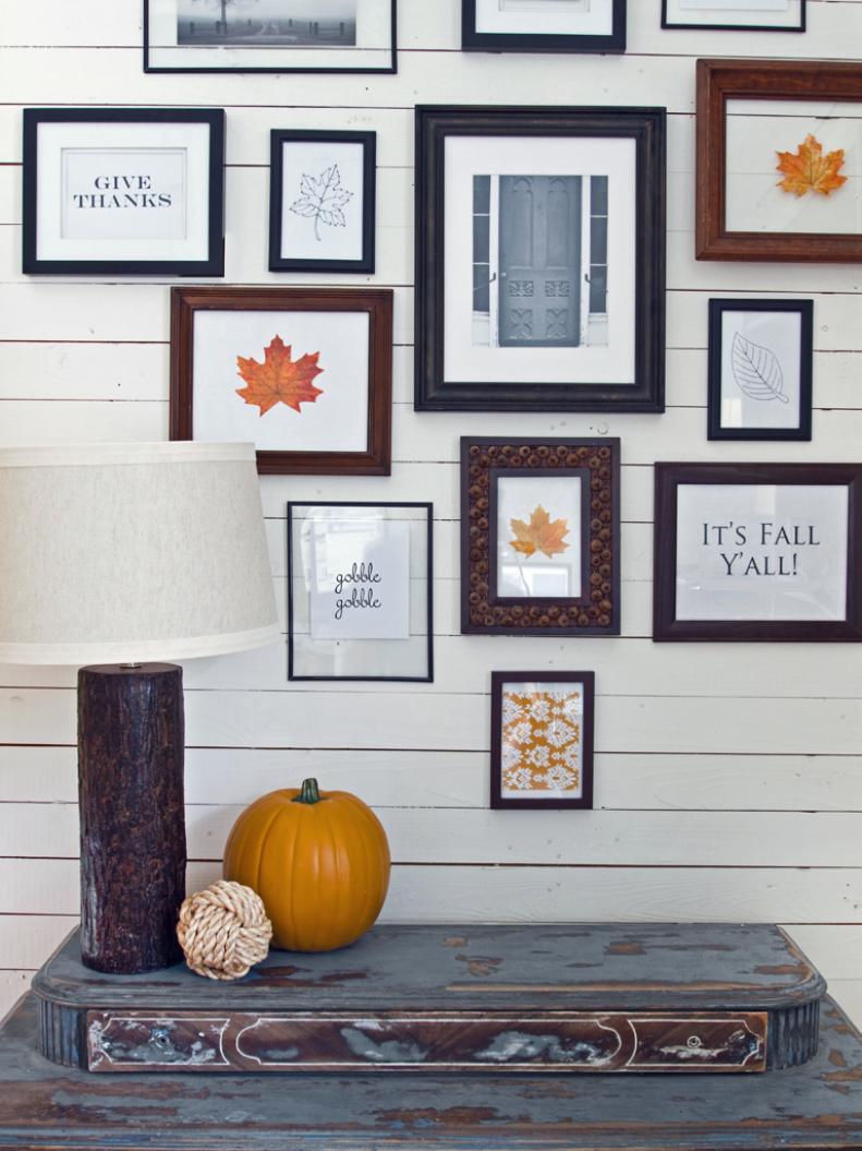 Blue and White Fall-Themed Gallery Wall Above Rustic Blue Table