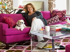 Homeowner With Dog on Pink Couch