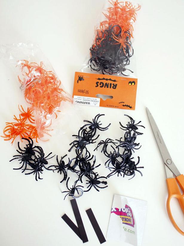 All the materials you need for this fun and easy project are: 1-2 bags of plastic spiders (I used spider rings), hot glue gun, scissors, and magnetic strips