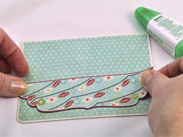 Attach matted trim piece to card base to make a decorative trim for the handmade holiday card.