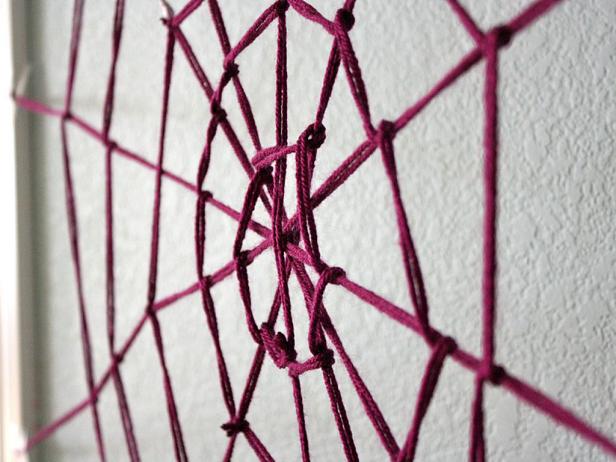 Purple yarn spider web