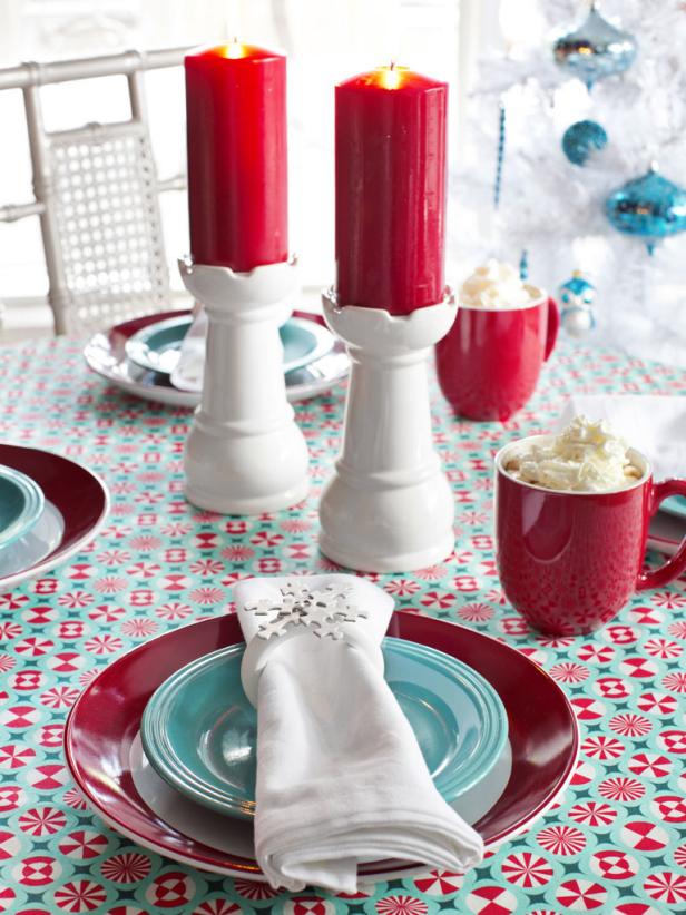 Red, white, and blue dishes on winter table setting
