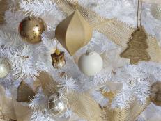 Metallic and Neutral Ornaments on White Christmas Tree 