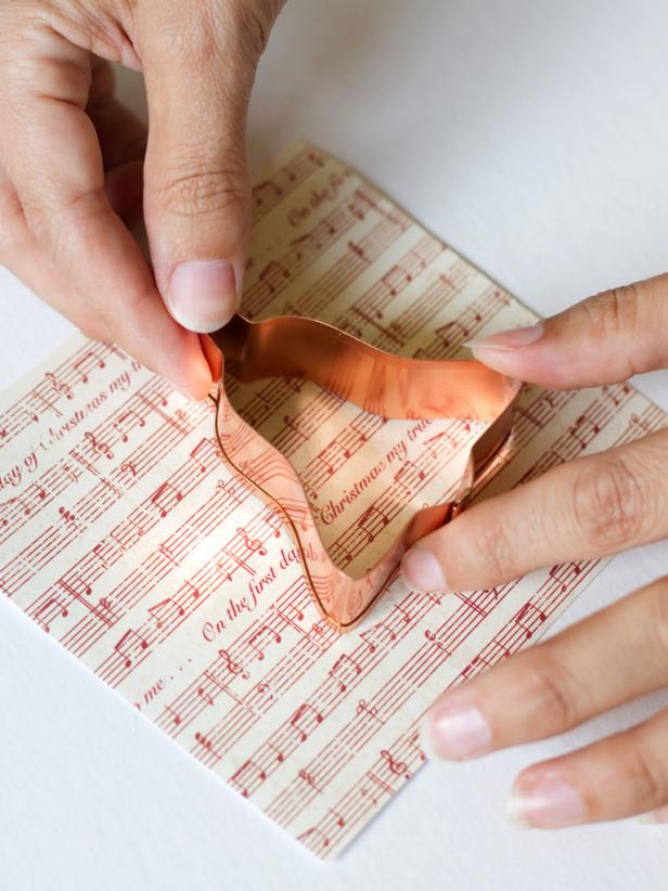 Glue Metal Cookie Cutter to Music Sheet Paper