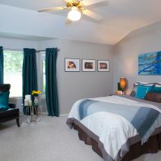 Contemporary Gray Master Bedroom with Blue Accents 