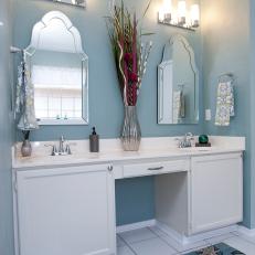 Blue Bathroom with Double Vanity and Mirrors 