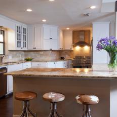 Traditional Kitchen With Breakfast Bar and Cowhide Barstools