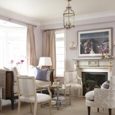 Glamorous Sitting Area With Gold-Accented Fireplace