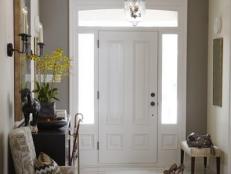 Foyer with taupe accent wall and a pair of pendant lights