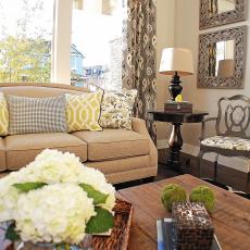 Neutral Transitional Living Room With Chartreuse Accents and Framed Mirrors