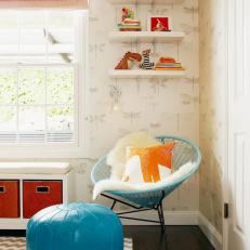 Neutral Kids' Bedroom With Blue Ottoman and Whimsical Wallpaper