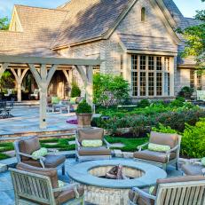 Traditional Brick Home With Fire Pit and Patio