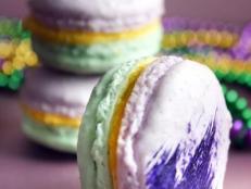 Purple and green macarons with gold filling. 