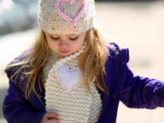 New to knitting? This is just the project for you! Keep your little one bundled up this winter with a hand-knit scarf that's a snap to make. Finish it off with a plush, embroidered heart pin that's the sweetest embellishment.