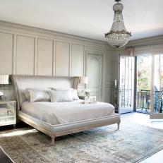 Neutral Bedroom With Paneled Walls and French Doors