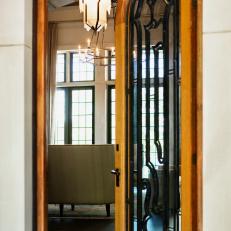 Arched Door Made With Light Wood, Iron and Glass