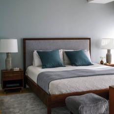 Master Bedroom in gray and blue with a wood platform bed
