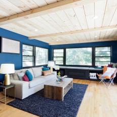 Contemporary Dark Blue Living Room with Natural Wood Ceiling