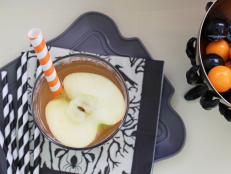 Pumpkin pie spice and apple cider lend autumnal flavor to this Halloween take on classic sangria. Serve in a hollowed-out pumpkin for a dramatic presentation.