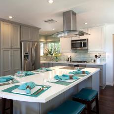 White and Gray Kitchen With Blue Barstools