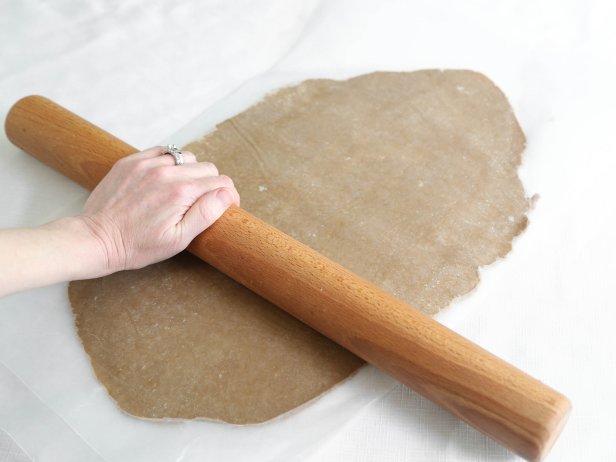 Line two baking sheets with parchment paper. Working with one disk at a time, roll out dough between two sheets of waxed paper to 1/4-inch thickness.