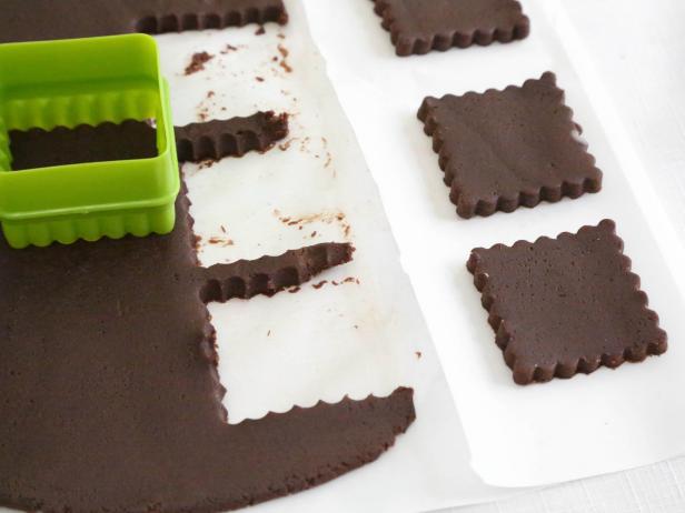 Cut dough into 3-inch squares using a cookie cutter and place on parchment–lined baking sheets.