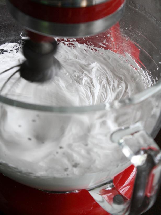 Pour the mixture of meringue powder and powdered sugar into bowl of a stand mixer fitted with whisk attachment. Add warm water and mix on high speed for about 5-7 minutes or until stiff peaks are achieved.
