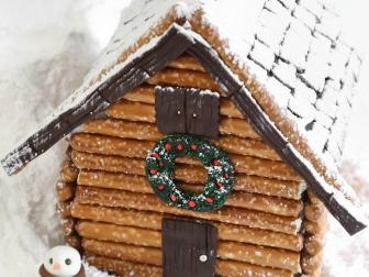 Gingerbread House With Chocolate Fondant and Pretzel Rods