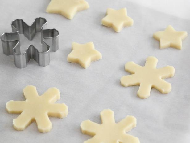 Cut out desired shapes from dough and transfer to prepared baking sheet.